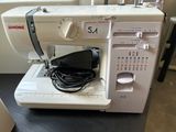 a sewing machine that is sitting on a table