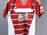 the shirt is red and white with a white stripe on it