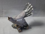 a bird that is sitting on top of a tree stump