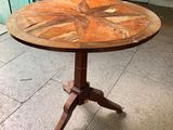 a wooden table with a star design on it