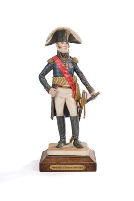 figurine of a man in a military uniform with a sword in his hand