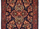 an antique persian rug with a red, blue and green design