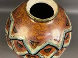 a vase that has a design on the inside of it