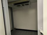 a bathroom with a toilet and a window in it
