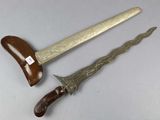 pair of antique bronzed swords with wooden handles