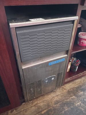 an image of a small refrigerator in the corner of a room