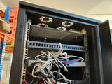 a rack with wires and wires in it in a room