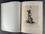 an open book with a drawing of a man holding a spear