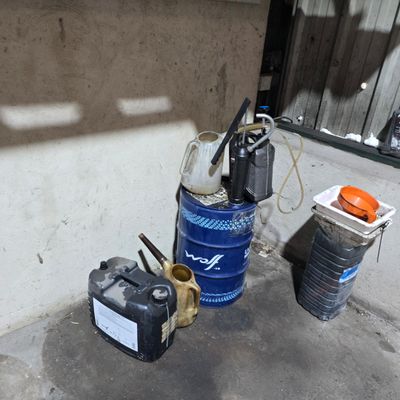 a blue barrel sitting next to a blue fire hydrant