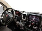 a dashboard view of a car with a steering wheel