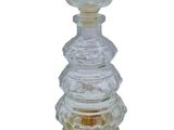 an image of a glass perfume bottle with a glass top