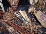 many different types of african masks on a table