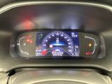 the dashboard of a car with a digital display on it