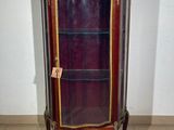 a display case with a glass door in a room