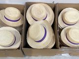 six boxes of straw hats are lined up in a cardboard box