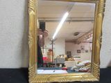 a person taking a picture of a mirror with a cell phone