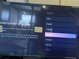 television screen showing a selectioner language in french and english