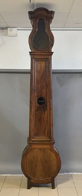 a grandfather clock in the middle of a room