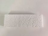 a piece of white paper on a white surface