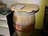 a wooden barrel that has a book on top of it