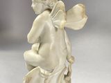 an image of a statue of a little girl with a flower in her hand