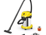 a yellow vacuum cleaner with a hose and other cleaning supplies