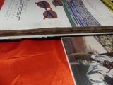 a lot of books that are laying on a table