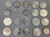 a close up of a bunch of coins sitting on top of a table
