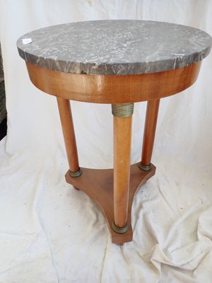 an image of a small table with a marble top on a white background