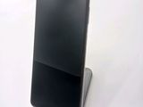 a cell phone that is sitting on top of a stand