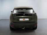 a picture of the rear end of a car in a garage