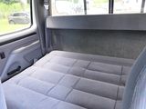 a car that has a mattress in the back of it