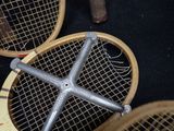 two tennis rackets that are laying on the floor