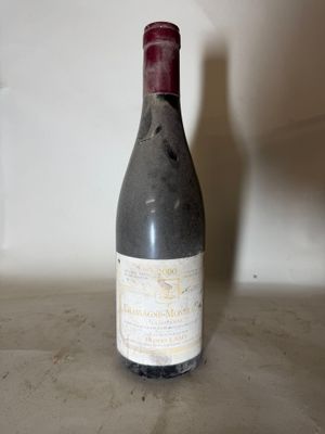 a bottle of wine that is sitting on a counter