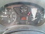 a close up of the dashboard of a car with a clock on it