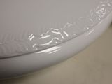 a close up view of a toilet seat with the lid down