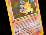 a yellow pokemon card with a picture of a dragon on it