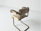 chair made of wood and metal on a white surface