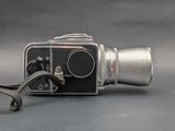 an old camera with a strap attached to it