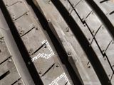 a close up of a tire on a wooden surface