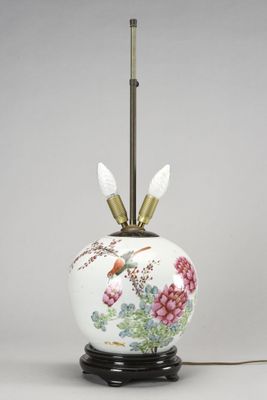 an image of a white vase with flowers and birds on it