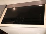 a microwave with a glass top in a kitchen
