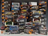 a lot of toy cars that are stacked up together