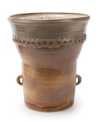 a brown vase with handles on a white background