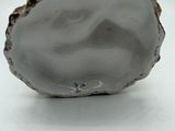 porcelain figurine of a woman in a shell with a man on it