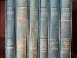 many books on a shelf in a book case