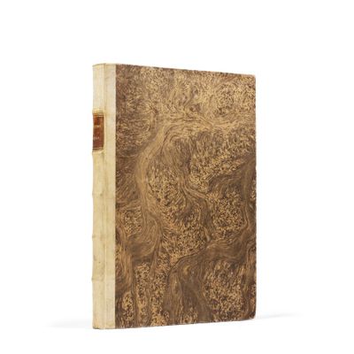 an old book with a brown cover and a wooden cover