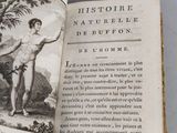 an open book with a picture of a man holding a banana