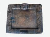 a picture of a metal picture frame with a man ' s face on it