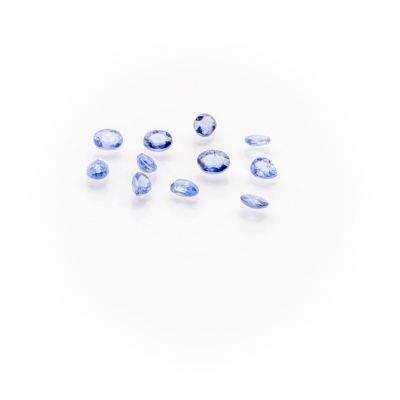 a group of blue sapphires on a white background